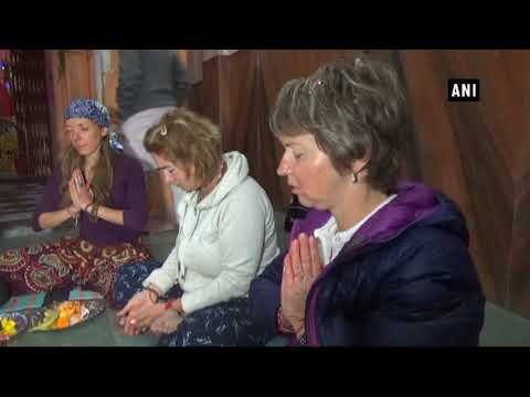 Foreigners supply prayers as per Hindu beliefs put up lunar eclipse 1