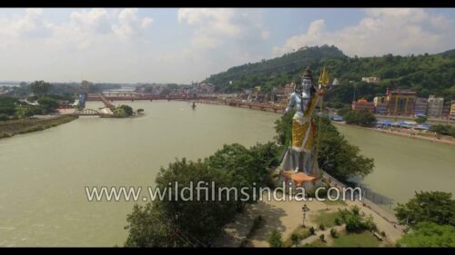 Fly over giant Shiva statue at Haridwar : aerial view of Hinduism central
