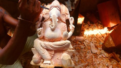 Hand carved wooden statue of Lord Ganesh made with real talent