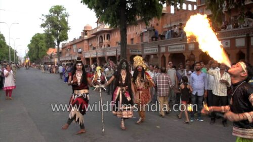 Lord Shiva and Goddess Kali pose for camera during Gangaur festival
