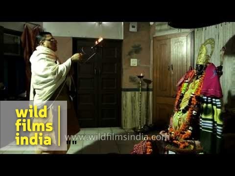 Priest performs aarti of Goddess Kali
